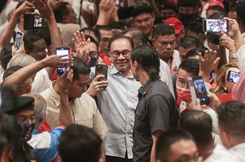 Pakatan Harapan chairman Datuk Seri Anwar Ibrahim arrives at the Pakatan Harapan 2022 Convention held at the Ipoh Convention Centre, October 20, 2022. — Picture by Farhan Najib