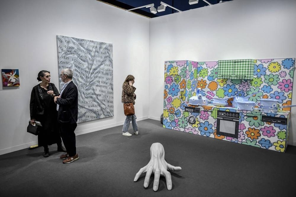 Visitors look at art pieces during the ‘Paris Art Basel’ event, ahead of the official opening of Europe’s biggest contemporary art market in Paris, on October 19, 2022. — AFP pic