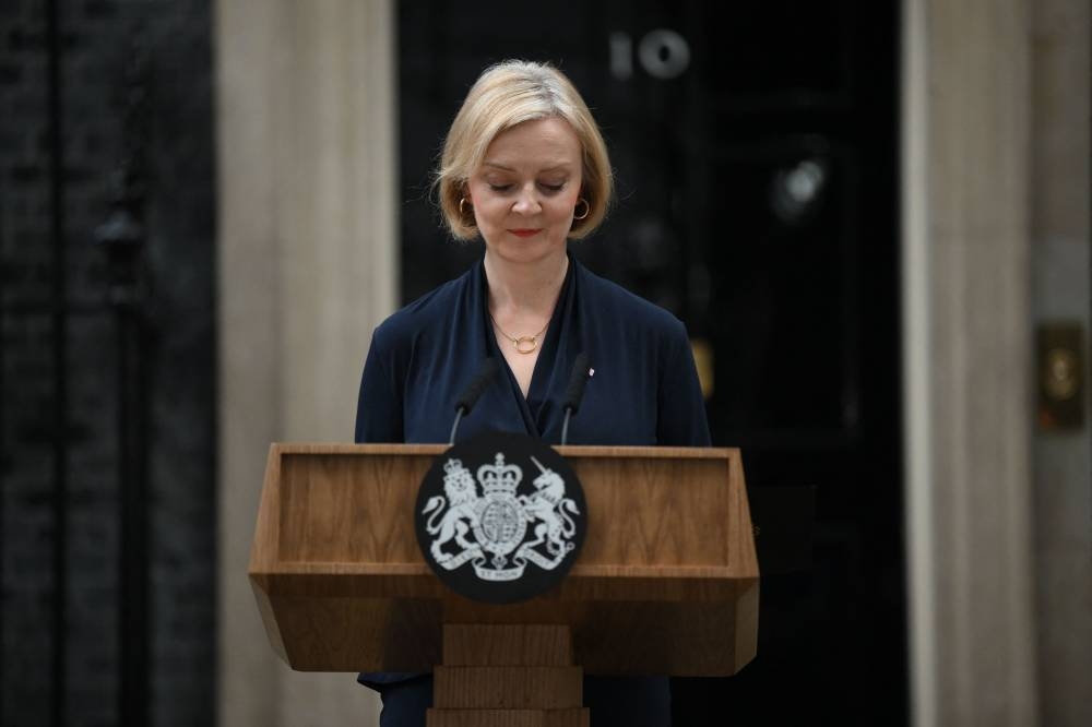 Britain's Prime Minister Liz Truss delivers a speech outside of 10 Downing Street in central London on October 20, 2022 to announce her resignation. — AFP pic