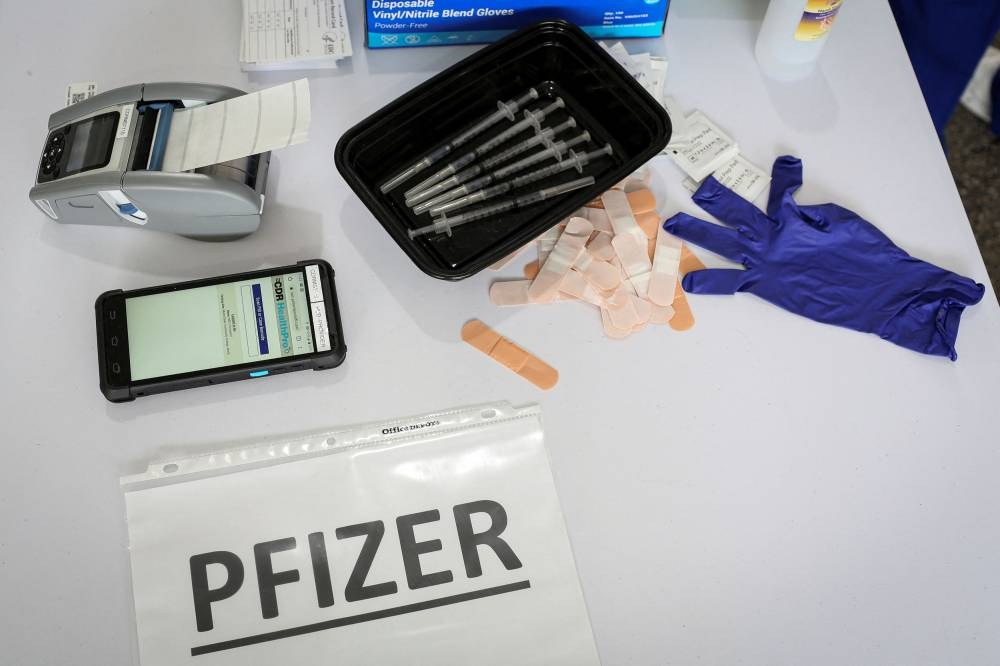 Doses of Pfizer coronavirus disease vaccines are seen in a mass vaccination site supported by the federal government at the Miami Dade College North Campus in Miami March 10, 2021. — Reuters pic