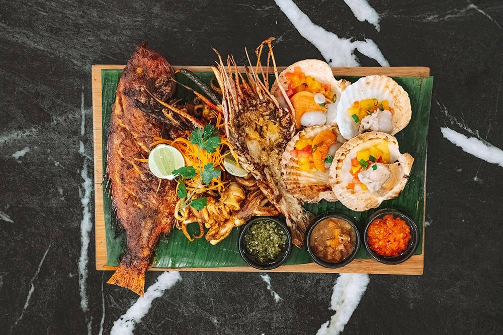 The Chow Kit Platters is great for larger groups and features various chargrilled items paired with 'nasi ulam' and their house-made sambals. — Picture courtesy of The Chow Kit — An Ormond Hotel