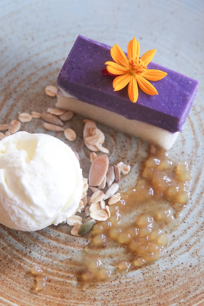 For a sweet ending, try the 'Ube Seri Muka' where the traditional 'kuih seri muka' is reimagined with a soft, creamy layer of sweet yam with soft glutinous rice and vanilla ice cream. — Picture by Choo Choy May