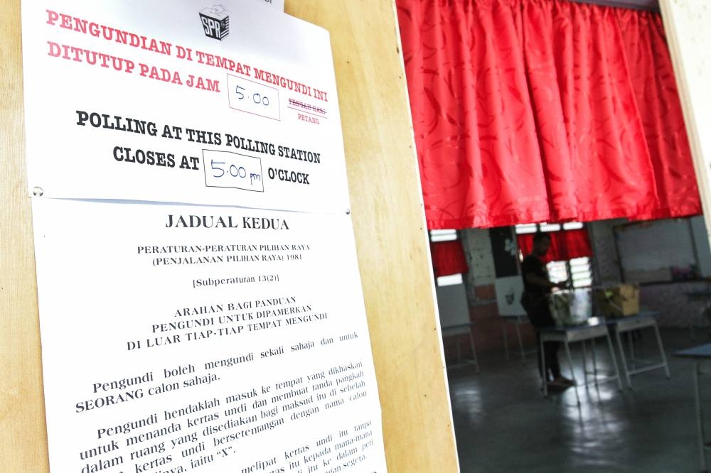 File picture of Malaysian voters queueing to cast their votes outside a polling centre for the 14th General Election (GE14) in SK Puchong Indah, Selangor, May 9, 2018. — Picture by Miera Zulyana