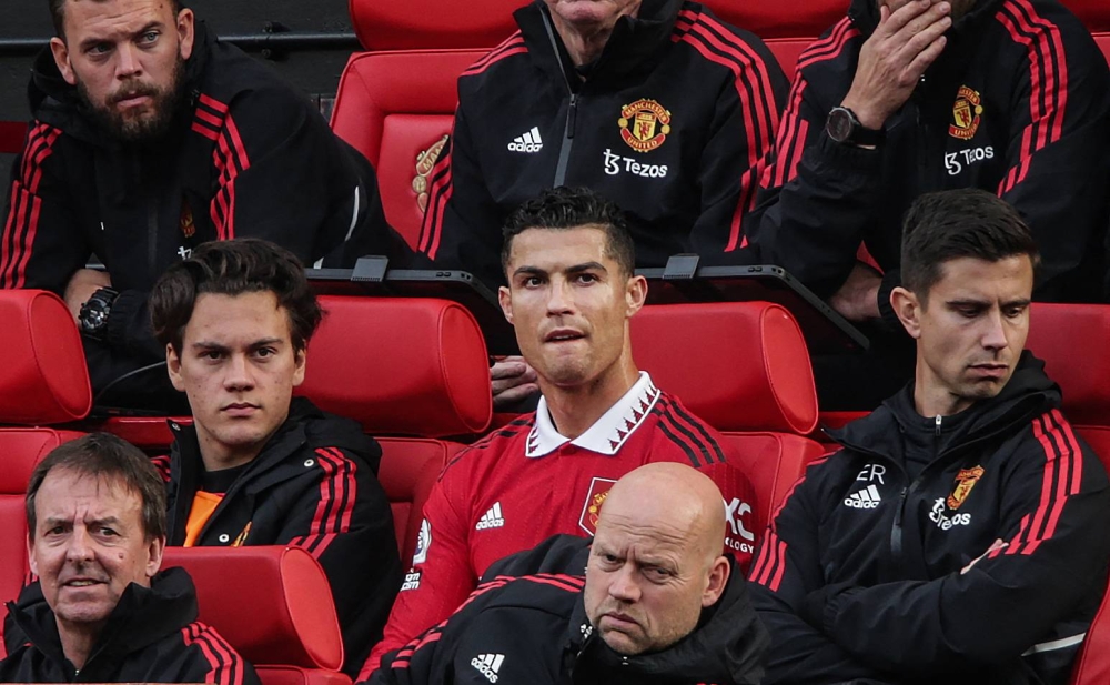 Manchester United striker Cristiano Ronaldo reacts as he sits on the bench during the EPL match between Manchester United and Newcastle at Old Trafford in Manchester, October 16, 2022. — AFP pic 