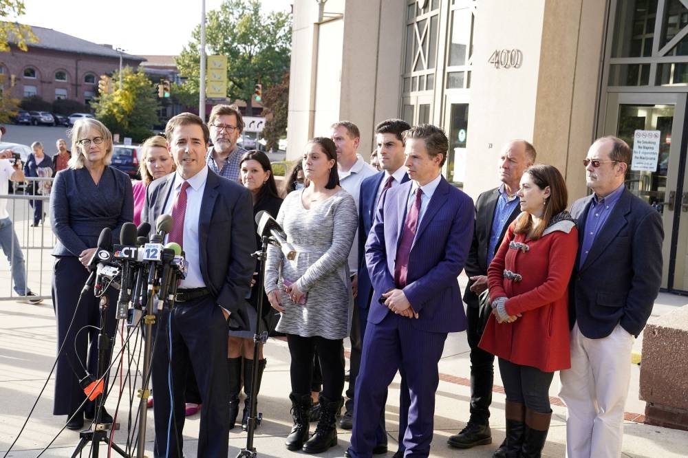 Attorney Chris Mattei addresses the media surrounded by families who lost loved ones during the Sandy Hook Elementary School Shooting, after the jury awarded them $965 million in damages in a second defamation trial against Alex Jones over Sandy Hook claims in Waterbury, Connecticut October 11, 2022.  — Reuters pic