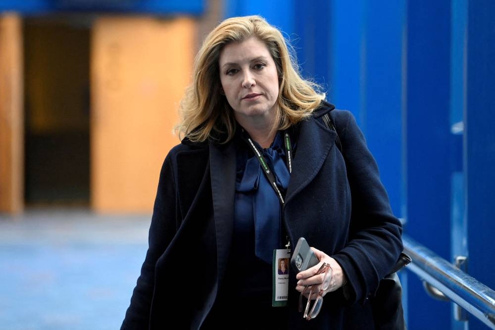 Britain’s Leader of the House of Commons Penny Mordaunt walks during the annual Conservative Party conference in Birmingham, Britain, October 2, 2022. — Reuters pic