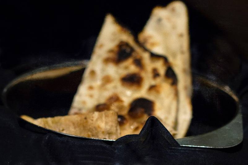 The char on a piece of 'naan' imparts so much smoky flavour.