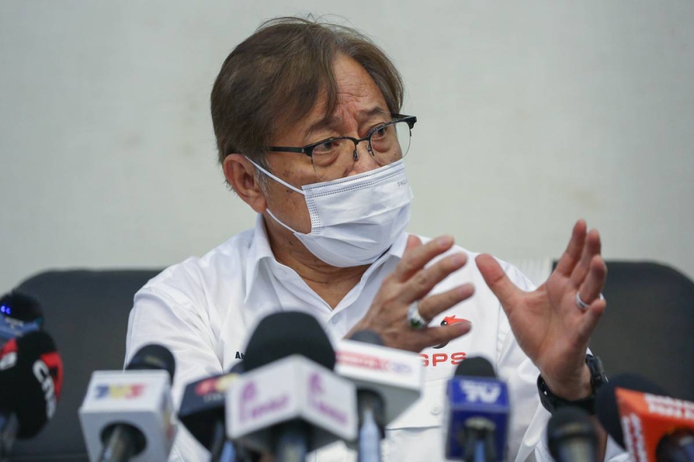 Gabungan Parti Sarawak's (GPS) chairman Tan Sri Abang Johari Openg speaks during a press conference at Borneo Convention Center in Kuching December 8, 2021. — Picture by Yusof Mat Isa