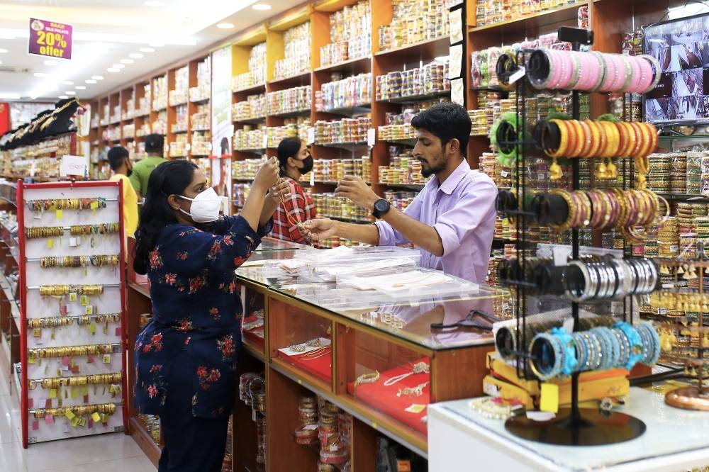 Shoppers are seen buying items in preparation for Deepavali at a shop in Little India Seremban October 23, 2022. — Bernama pic