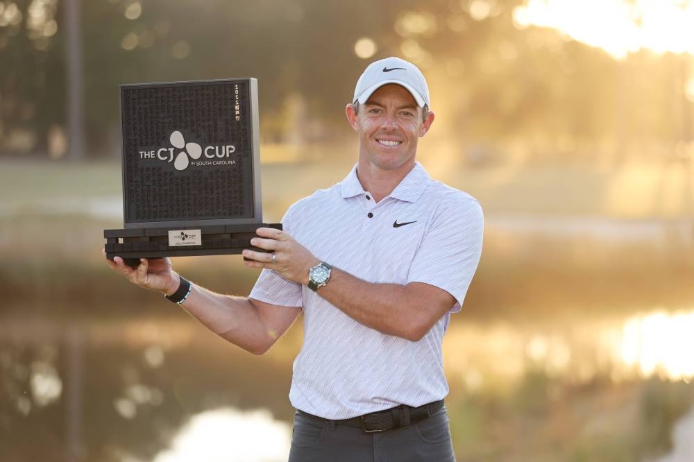 Rory McIlroy of Northern Ireland celebrates with the trophy after winning during the final round of the CJ Cup at Congaree Golf Club on October 23, 2022 in Ridgeland, South Carolina. — Gregory Shamus/Getty Images/AFP pic