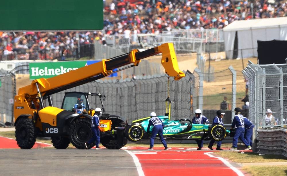  Aston Martin's Lance Stroll is towed away. — Reuters pic