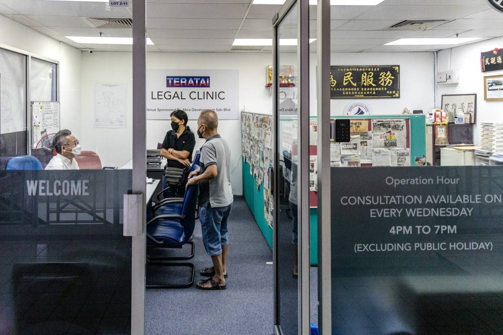 Incumbent Teratai assemblyman Bryan Lai listening to the grouses of his constituents at his legal clinic on October 21, 2022. — Picture by Firdaus Latif