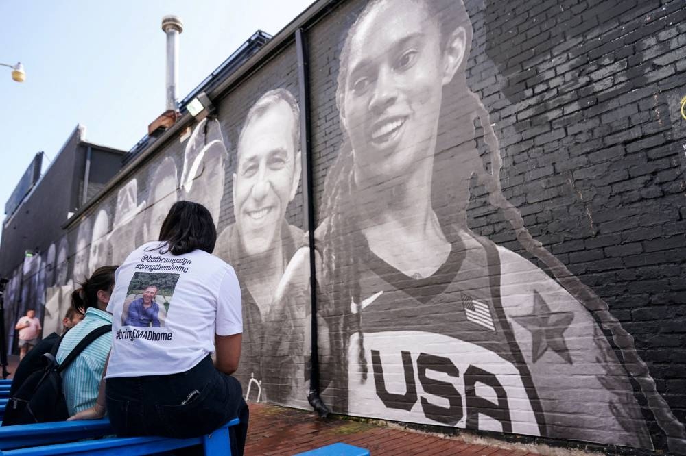People visit a mural of Brittney Griner and other hostages around the world created by the Bring Our Families Home Campaign, a campaign led by family members of Americans wrongfully detained or held hostage abroad, in Washington July 20, 2022. — Reuters pic