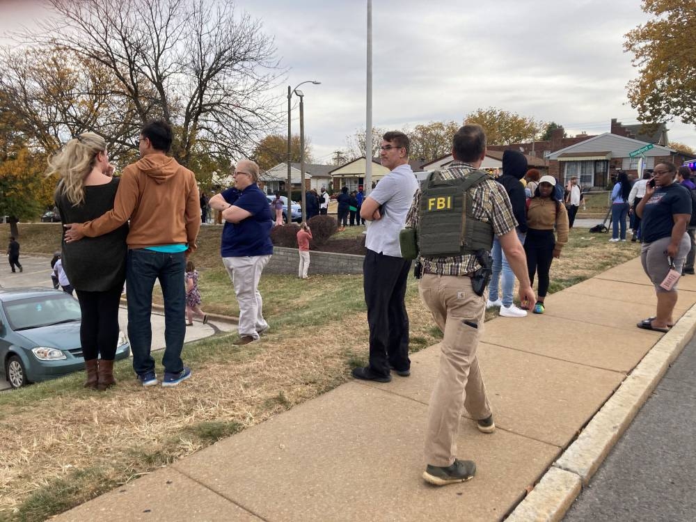 People gather following a shooting at a high school, in St. Louis, United States, October 24, 2022, in this still image. ― Picture courtesy of Holly Edgell/NPR Midwest Newsroom/ via Reuters