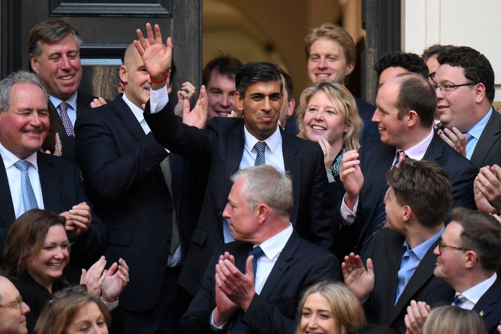New Conservative Party leader and incoming prime minister Rishi Sunak waves as he arrives at Conservative Party Headquarters in central London having been announced as the winner of the Conservative Party leadership contest, on October 24, 2022. ― AFP pic 