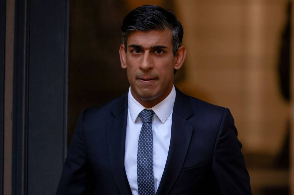 New leader of Britain's Conservative Party Rishi Sunak walks outside the party's headquarters in London, Britain October 24, 2022. ― Reuters pic