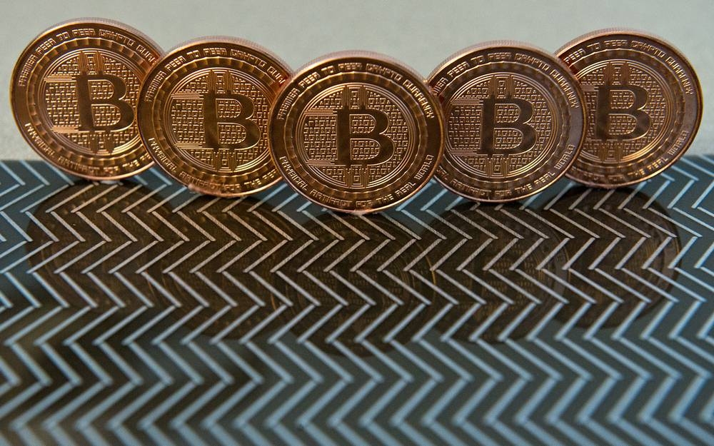 Both bitcoin and the US 10-year note are now hovering at around 21, according to a measure of realized volatility, while at the start of September bitcoin volatility was more than double that of the bond, at 65 versus 31. —AFP pic