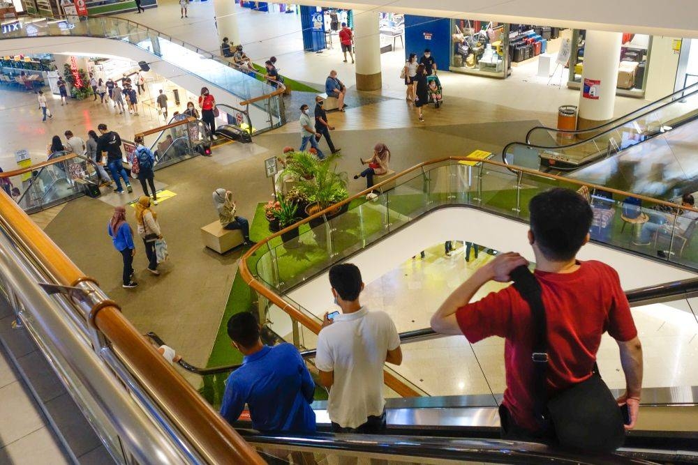 Shoppers are back in the malls but many retailers still need help with their business recovery. — Picture by Shafwan Zaidon