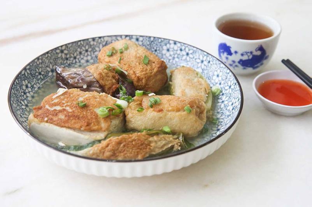 Relish homestyle Hakka Yong Tau Foo stuffed with fish paste and pork.