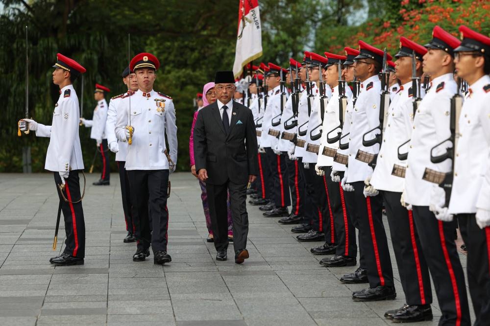 Yang di-Pertuan Agong Al-Sultan Abdullah Ri’ayatuddin Al-Mustafa Billah Shah inspects a guard of honour in Singapore, October 26, 2022. — Bernama pic 