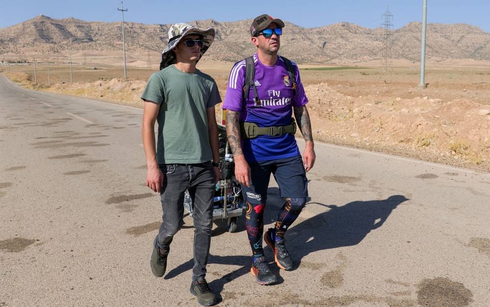Santiago Sanchez walks in Iraq's Kurdistan region towards Qatar, where he aims to attend the 2022 World Cup, near Zakho, Iraq August 28, 2022. — Reuters pic