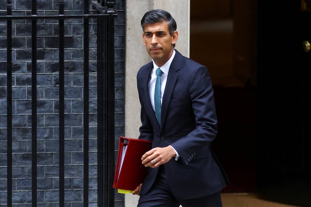 Britain's Prime Minister Rishi Sunak walks outside Number 10 Downing Street, in London October 26, 2022. — Reuters pic