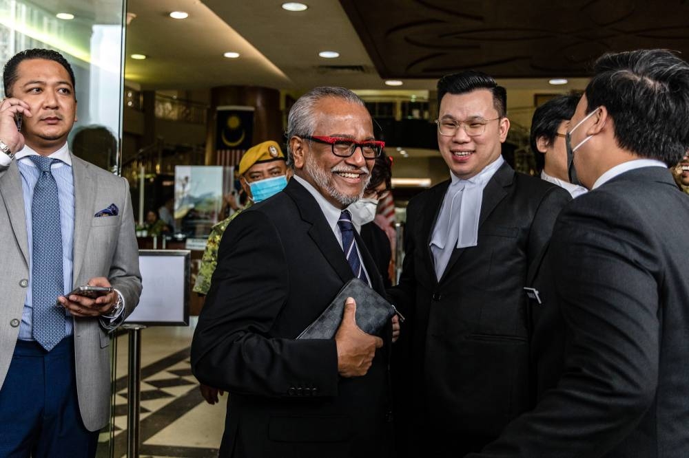 Lawyer Tan Sri Muhammad Shafee Abdullah is all smiles at the Kuala Lumpur High Court October 28, 2022. — Picture by Firdaus Latif