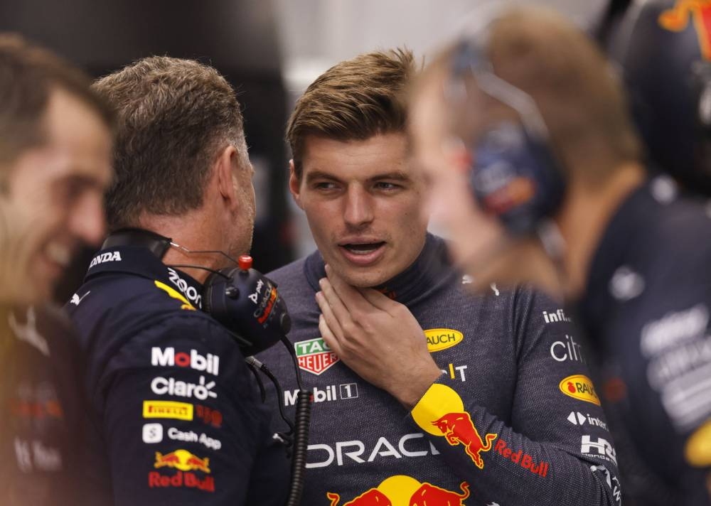 Red Bull’s Max Verstappen speaking with Red Bull team principle Christian Horner before practice session during the Singapore Grand Prix at the Marina Bay Circuit in Singapore, October 1, 2022. ― Reuters pic