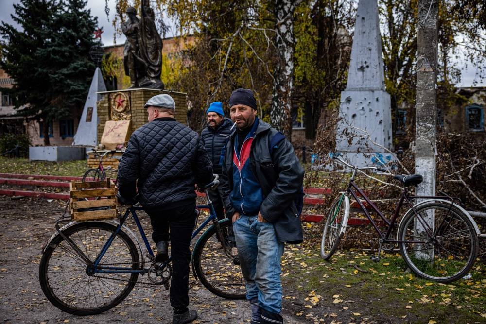 Local residents wait a Ukraine post office car in the village of Drobysheve in eastern Ukraine’s Donetsk region, on October 28, 2022, after the liberation of the area. — AFP pic