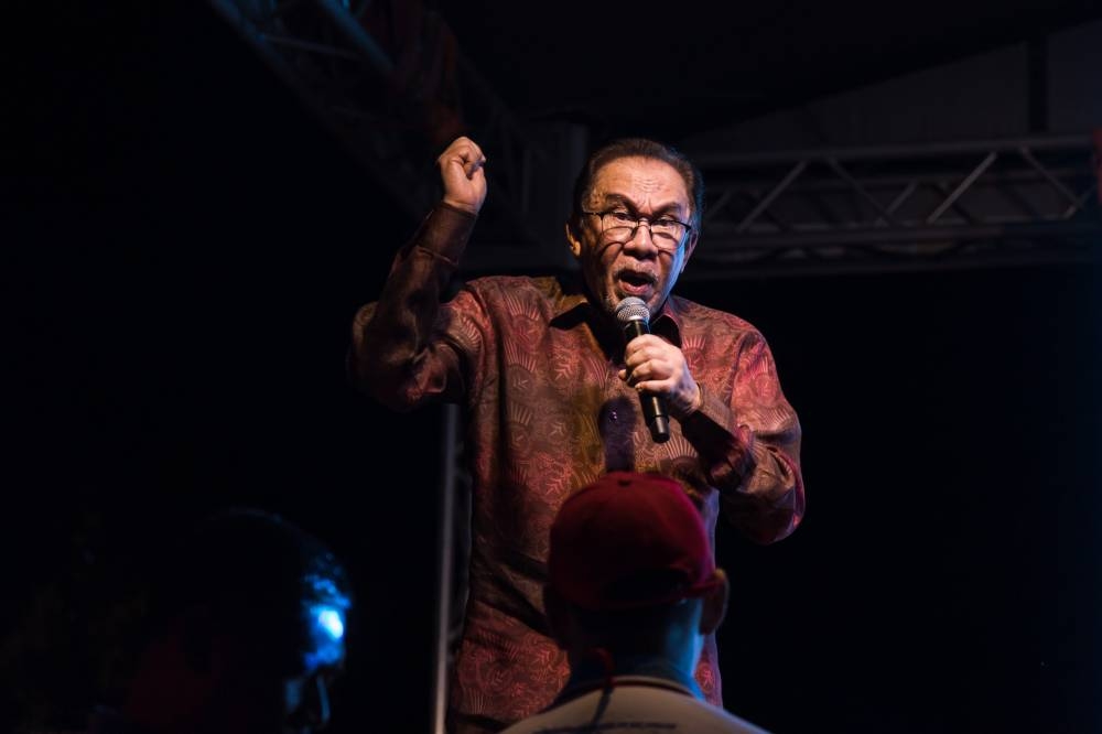 PKR president Datuk Seri Anwar Ibrahim speaking during a rally to announce the party's candidates ahead of the upcoming 15th general elections at Padang MPAJ Taman Kosas in Ampang on October 28, 2022. — Picture by Firdaus Latif