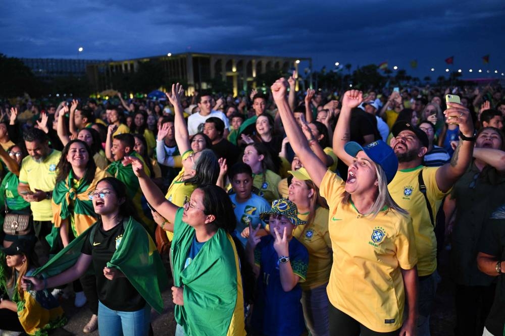 Supporters of Brazilian President and re-election candidate Jair Bolsonaro attend an evangelical event at the Ministries Esplanade in Brasilia, on October 28, 2022. — AFP pic