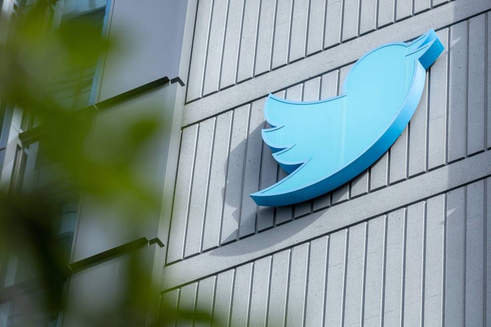 The Twitter logo is seen on a sign on the exterior of Twitter headquarters in San Francisco, California, on October 28, 2022. — AFP pic