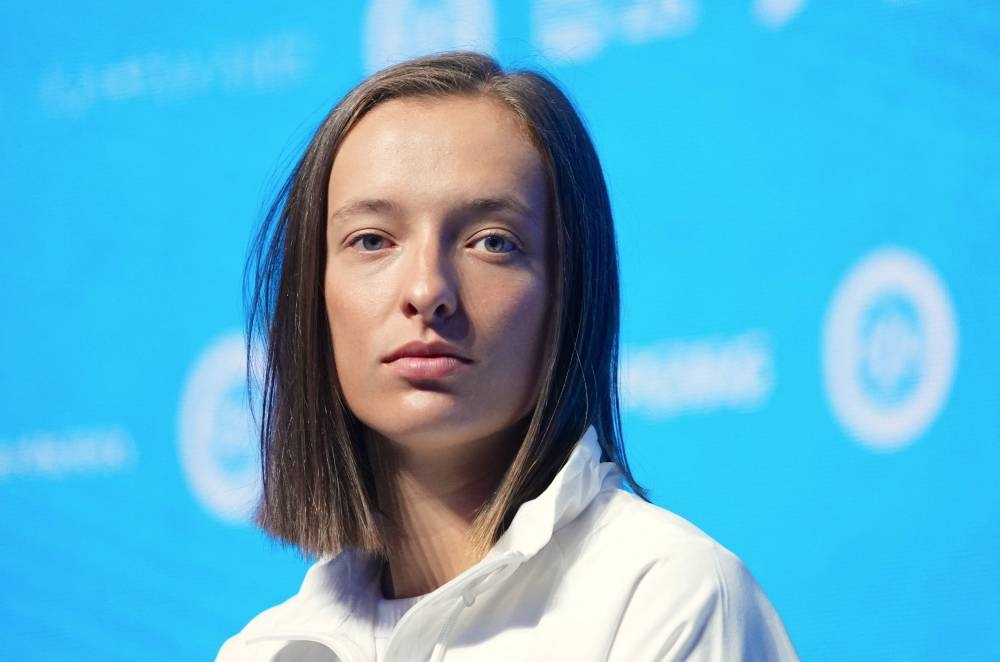 World number one Iga Swiatek said she was left feeling confused after Simona Halep was handed a provisional ban for doping. — AFP pic