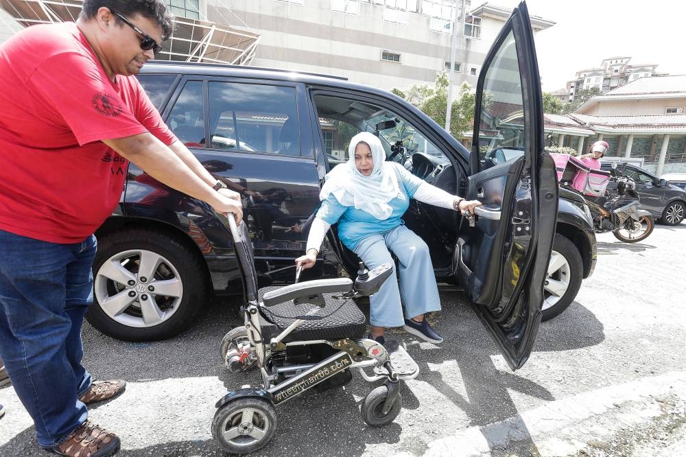 Noraishah Mydin Abdul Aziz, who suffers from spina bifida, made it clear to her supporters in the federal administrative capital yesterday that she is tougher than she looks. — Picture by Sayuti Zainudin