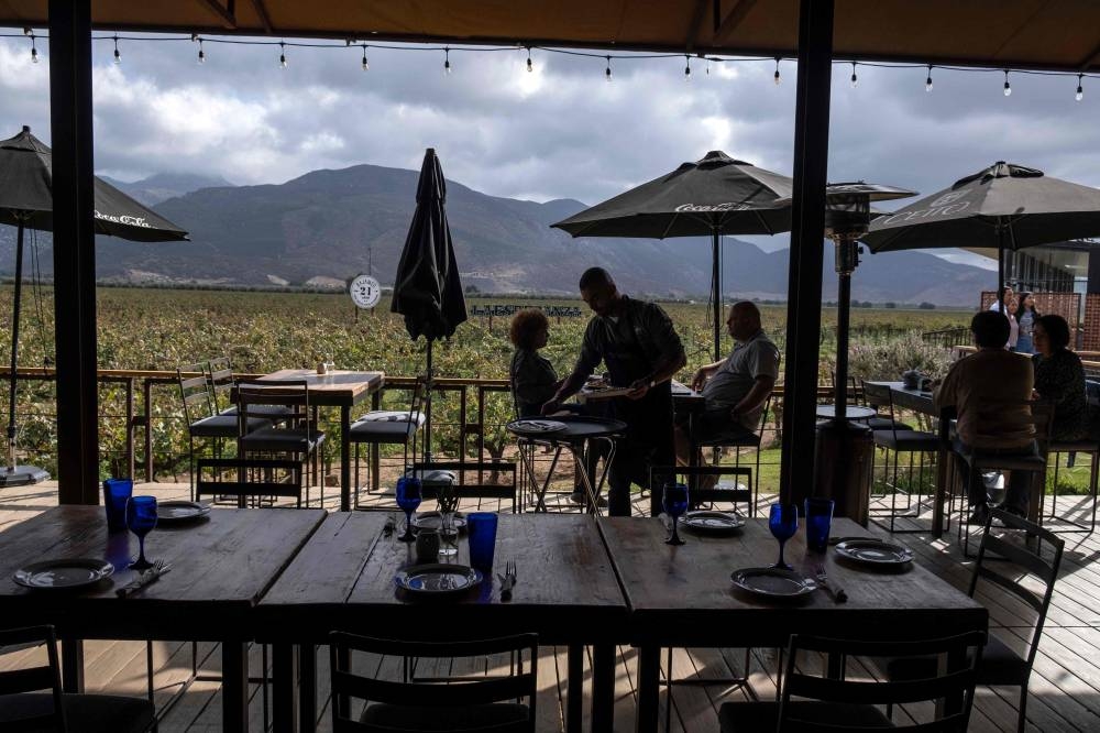 Guests eat at La Esperanza restaurant in Valle de Guadalupe, Baja California state, Mexico, on October 22, 2022. — AFP pic