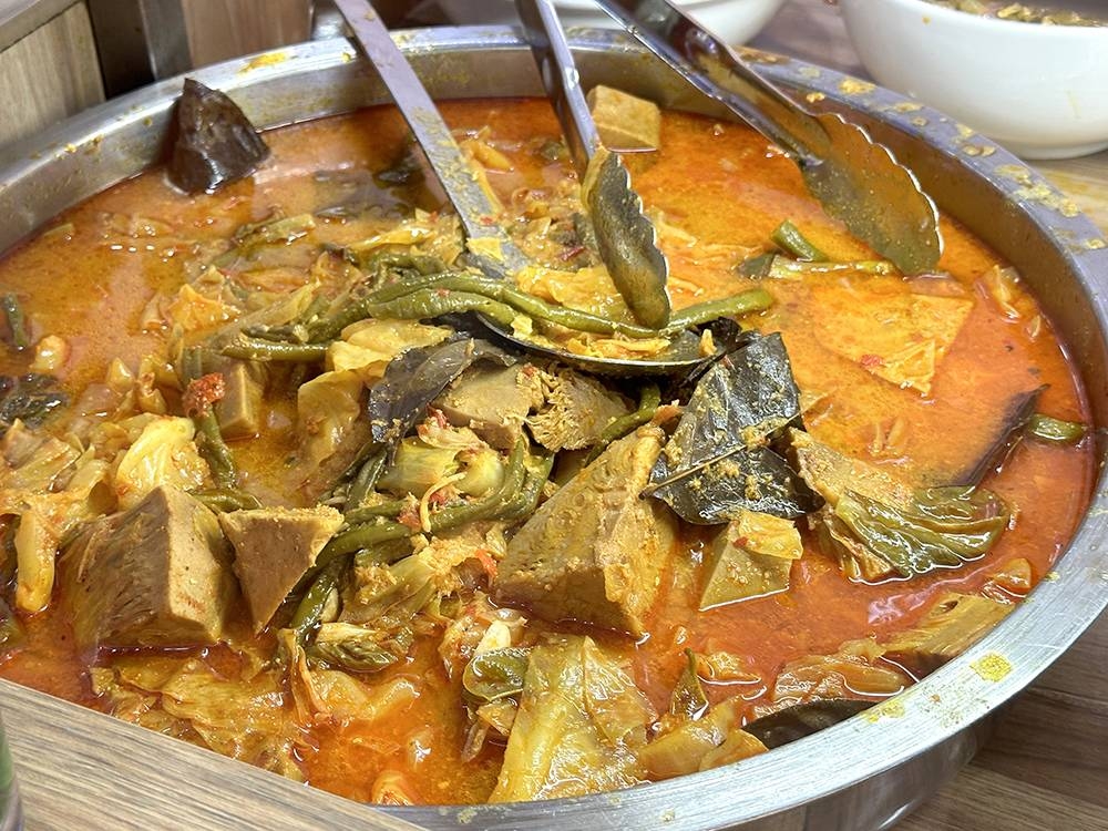 Unique to this restaurant is the 'sayur kapau' or mixed vegetables served with curry.