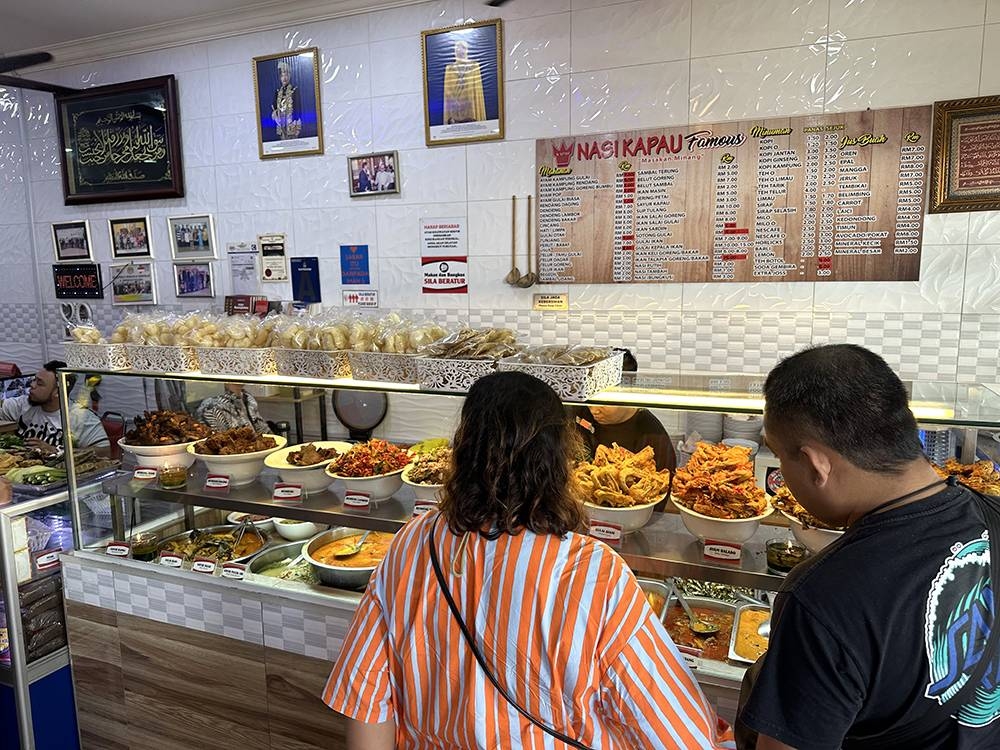 The queue is long as many people will ponder over their choices at the counter.