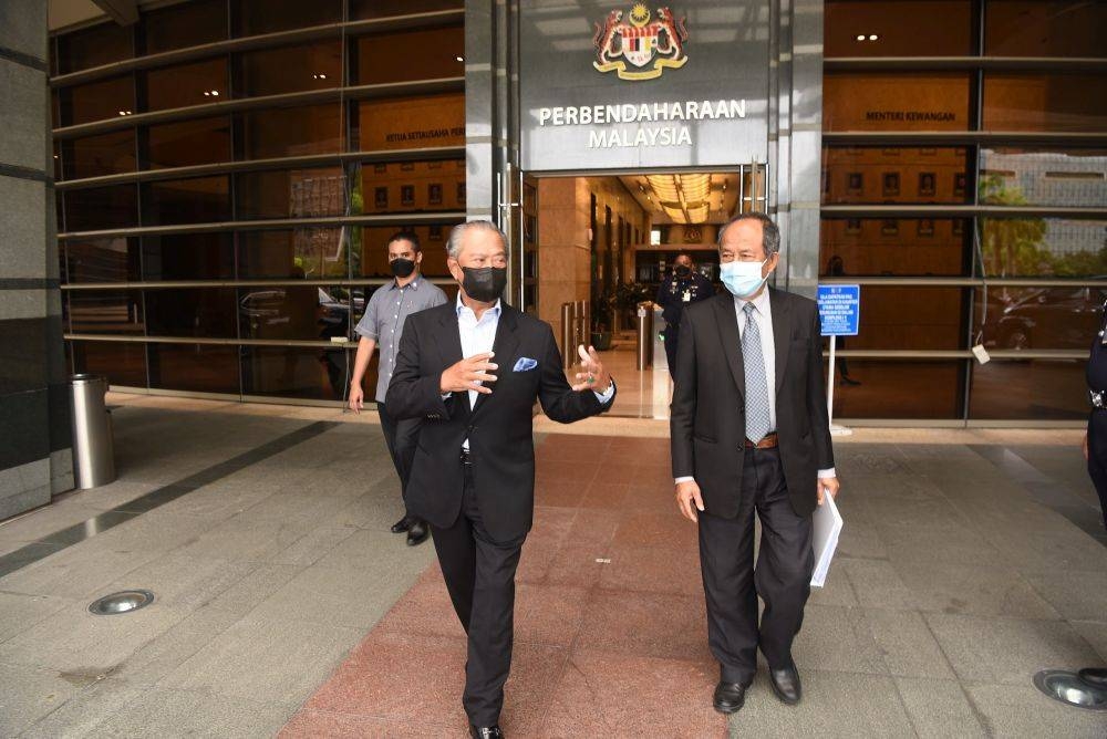 Tan Sri Sulaiman Mahbob (right) with NRC chairman Tan Sri Muhyiddin Yassin leaving one of their meetings. — Picture courtesy of the National Recovery Council