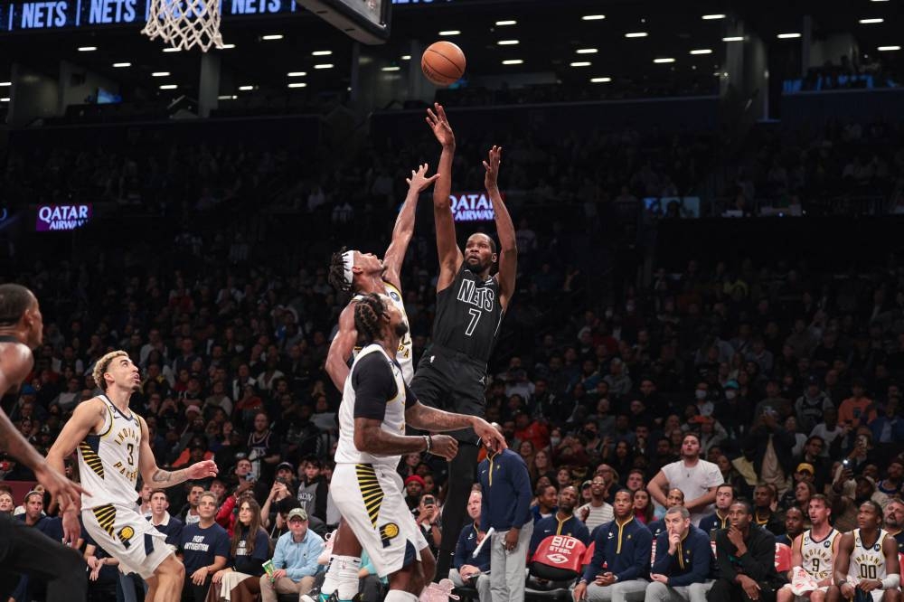 Brooklyn Nets forward Kevin Durant (7) shoots the ball against Indiana Pacers guard Buddy Hield (24) and forward James Johnson (16) during the first half at Barclays Center in Brooklyn October 31, 2022. — Reuters pic