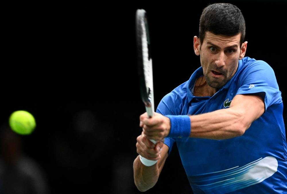 Serbia's Novak Djokovic plays a backhand return against US' Maxime Cressy on day two of the Paris Masters November 1, 2022. — AFP pic