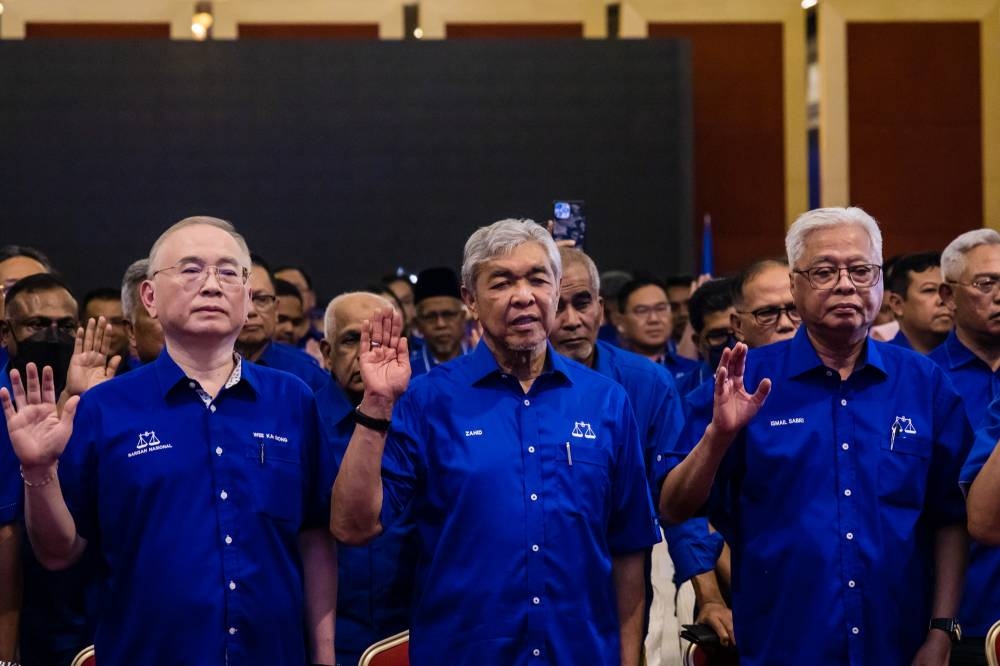 Barisan Nasional chairman Datuk Seri Ahmad Zahid Hamidi (centre) during the unveiling of the coalition's GE15 candidates at World Trade Centre Kuala Lumpur November 1, 2022. — Picture by Firdaus Latif