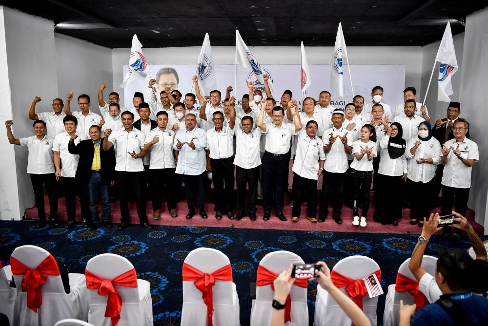 Parti Warisan’s (Warisan) president Datuk Seri Shafie Apdal (centre) poses with the party’s candidates who will be contesting 52 parliamentary seats and 16 state seats in GE15 during a ceremony in Kuala Lumpur November 1, 2022. — Bernama pic
