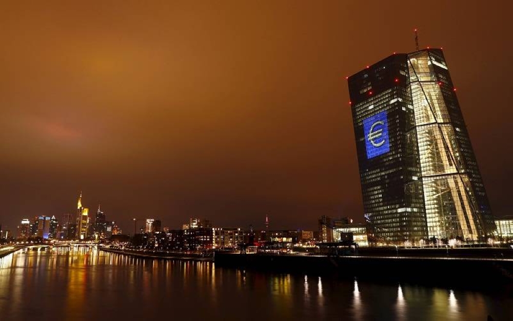 The headquarters of the European Central Bank (ECB) is illuminated with a giant euro sign at the start of the ‘Luminale, light and building’ event in Frankfurt March 12, 2016. — Reuters pic