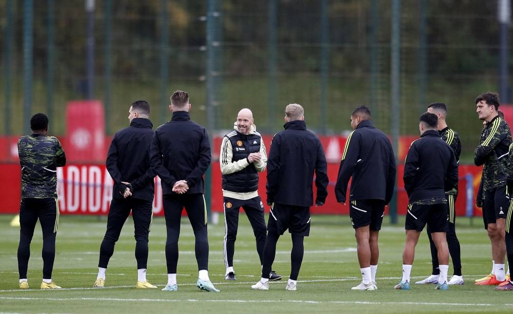 Manchester United manager Erik ten Hag talks to players during training at the Aon Training Complex, Manchester November 2, 2022. — Reuters pic