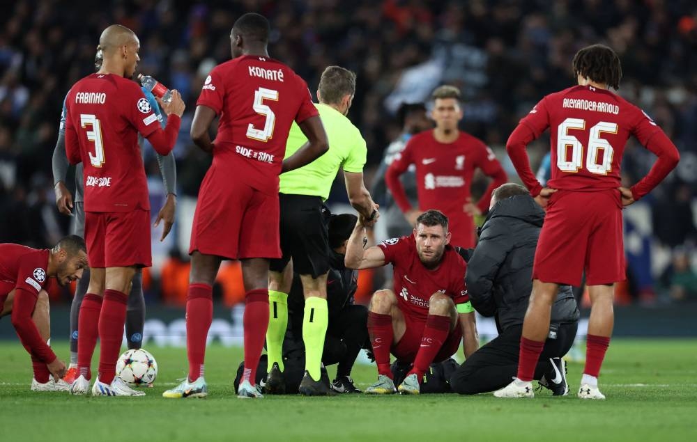 Liverpool's James Milner receives medical attention during the match against Napoli at Anfield, Liverpool November 1, 2022. — Reuters pic