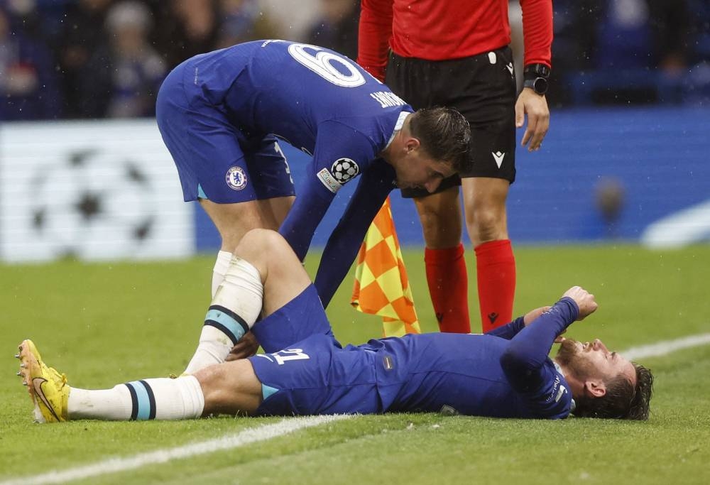 Chelsea's Ben Chilwell down injured as Mason Mount looks on during the match against Dinamo Zagreb at Stamford Bridge, London November 2, 2022. — Reuters pic