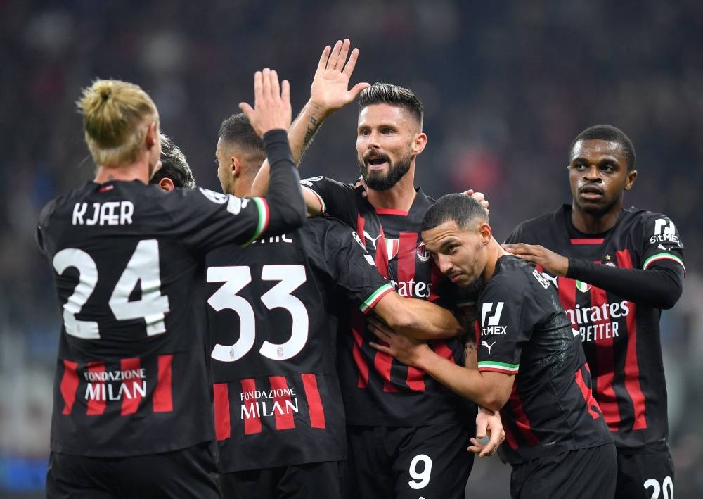 AC Milan's Olivier Giroud celebrates scoring their first goal against Salzburg with teammates at the San Siro, Milan November 2, 2022. — Reuters pic