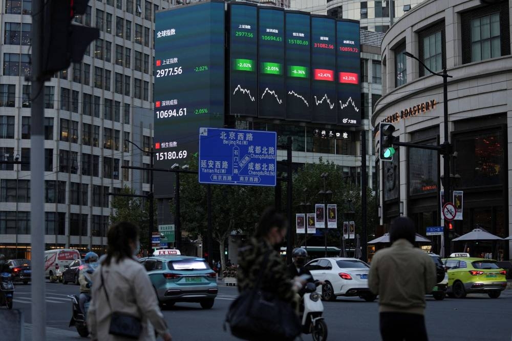 A view of a giant display of stock indexes in Shanghai October 24, 2022. — Reuters pic