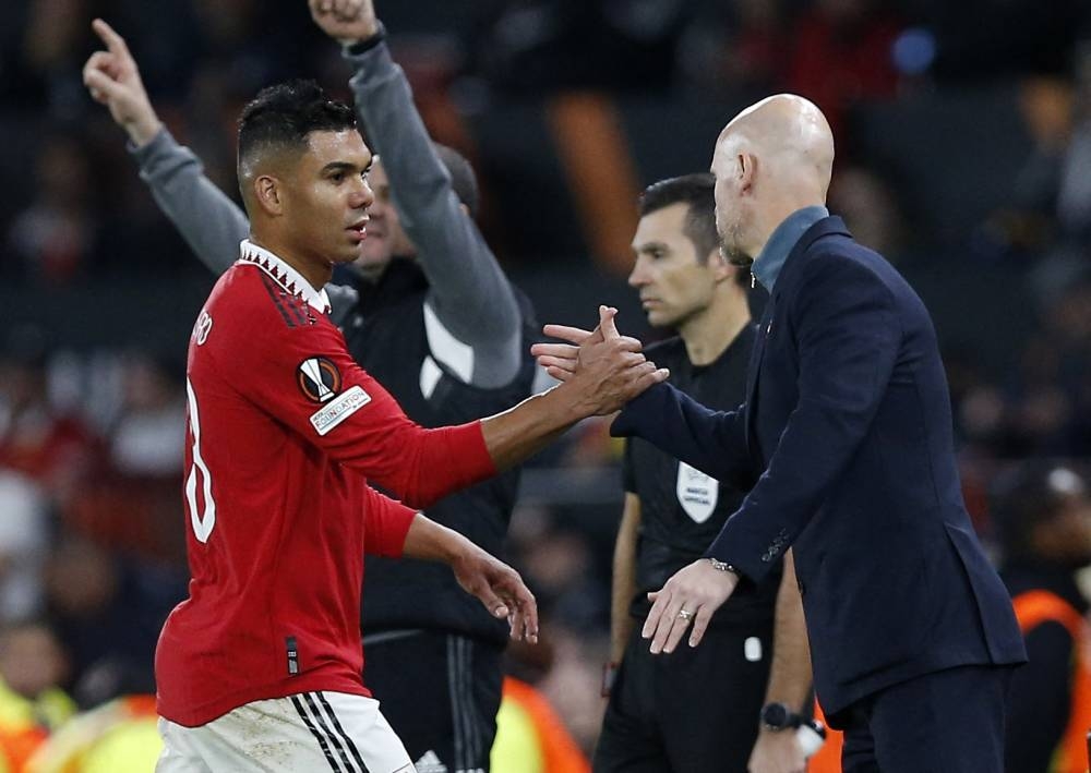 Manchester United's Casemiro shakes hands with manager Erik ten Hag after being substituted during the match against Sheriff Tiraspol at Old Trafford, Manchester October 27, 2022. — Reuters pic
