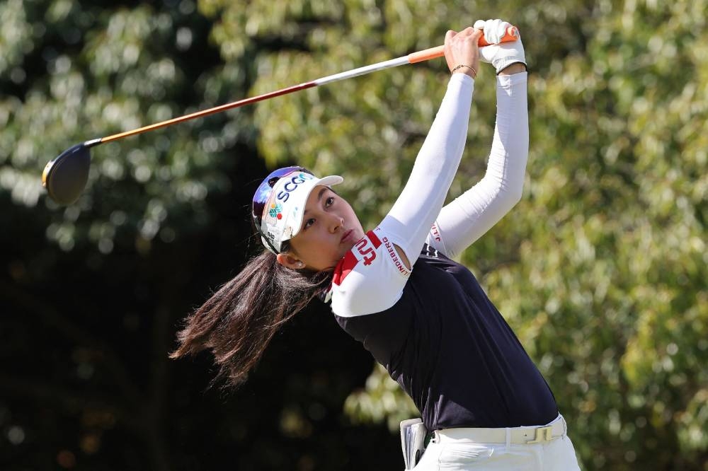 Atthaya Thitikul of Thailand hits a shot during the first round of the LPGA Japan Classic golf tournament in Otsu, Shiga prefecture, November 3, 2022. — Jiji Press handout pic via AFP 